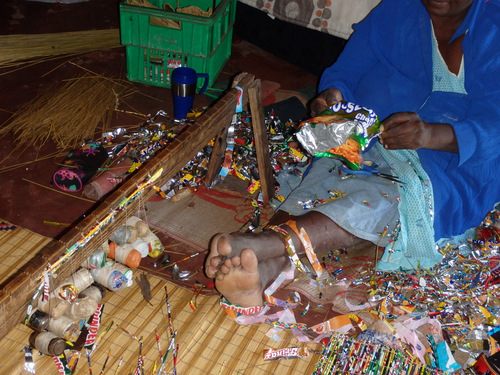 Grandmother demonstrates how to select and make a Mylar strip.